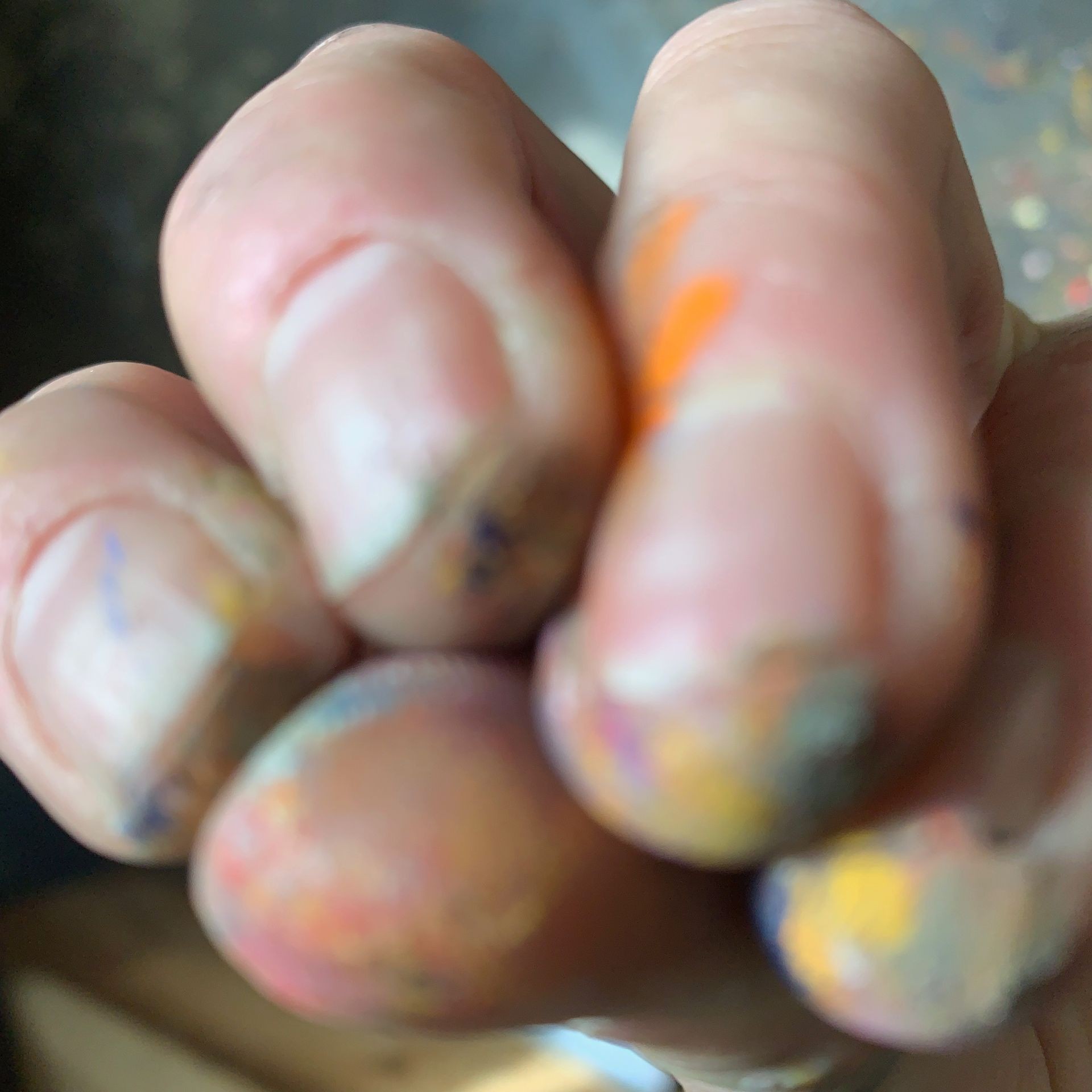 Photo of fingers covered in chalk pastel